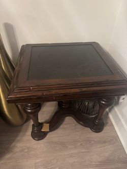 Dark wood end table with black top