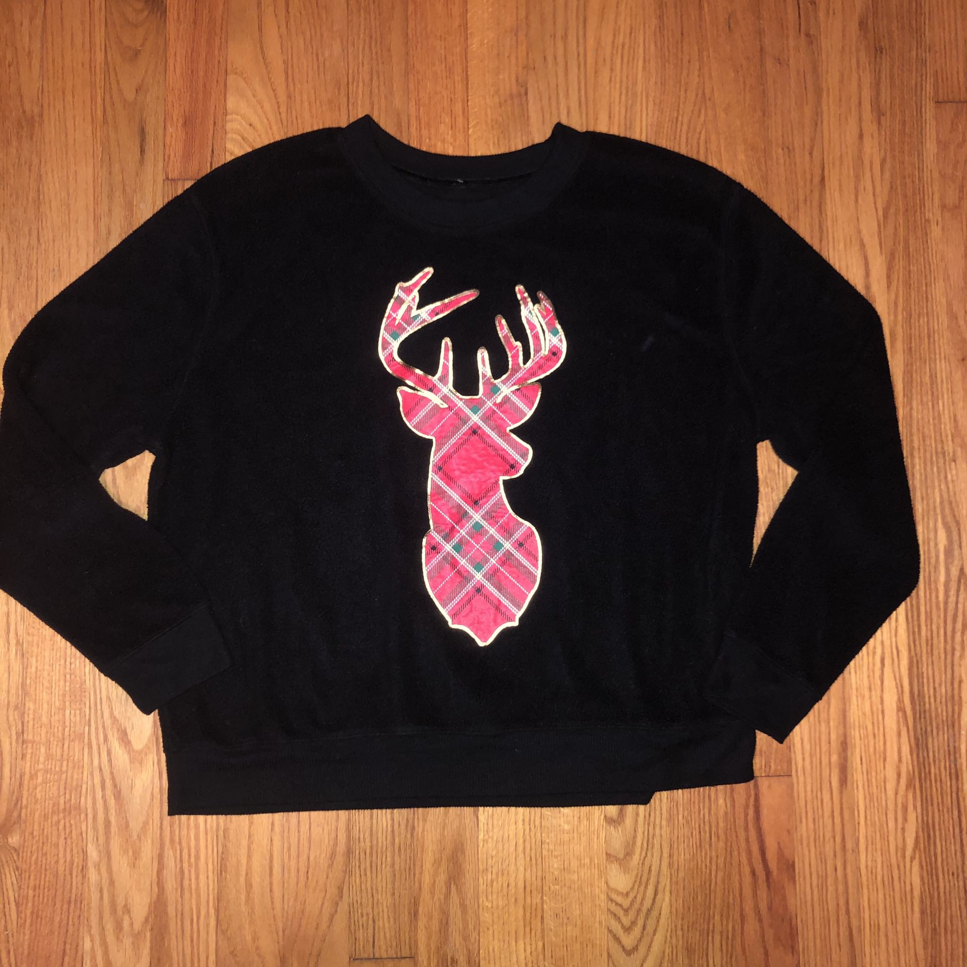 Justify size XL black sweatshirt with a plaid reindeer on the front