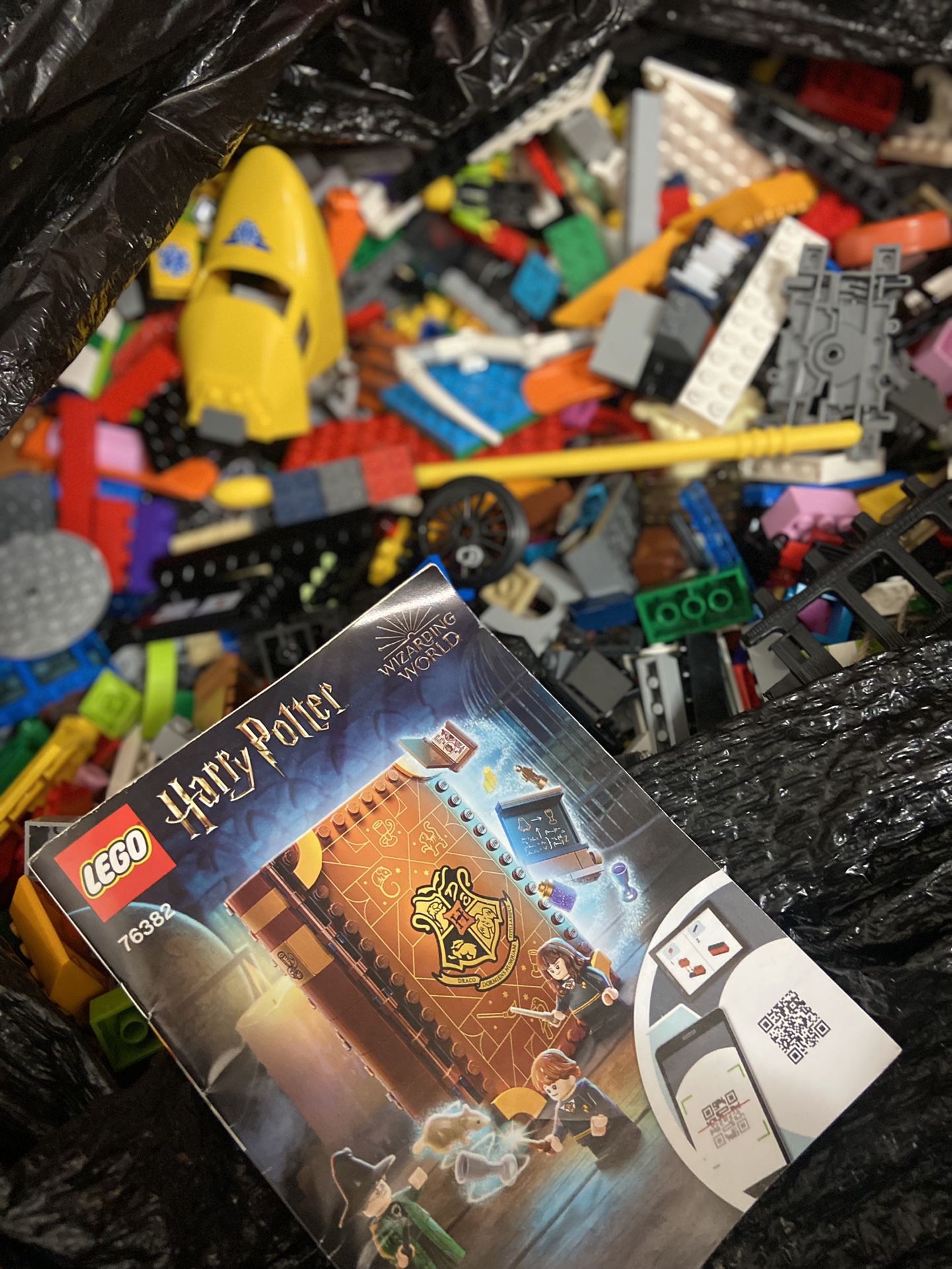 Hundreds of pieces of Legos Harry Potter was laying world set as well inside