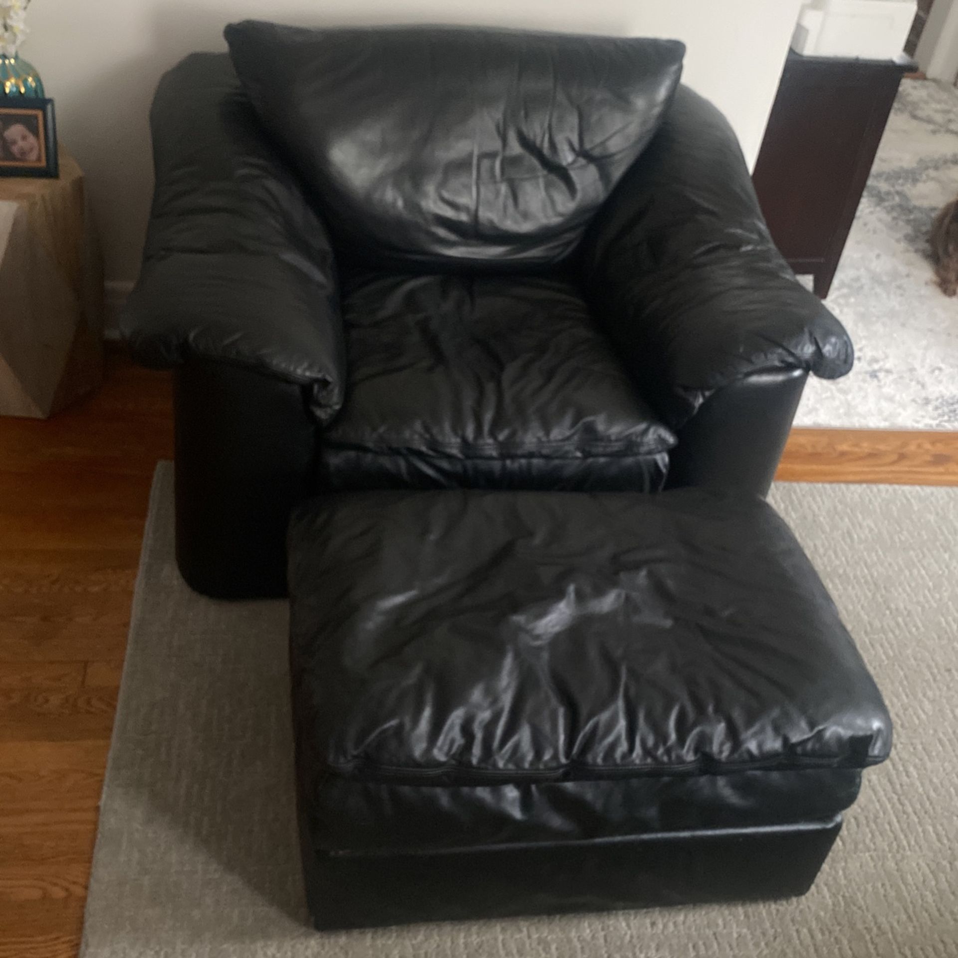 Oversize black, leather chair with Ottoman