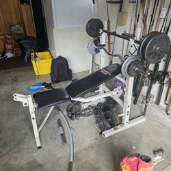  Great Shape No Tears In The Bench Comes With Two Straight Bars And One Curl Bar . Bench Has Pull Down Pulley Accessory 