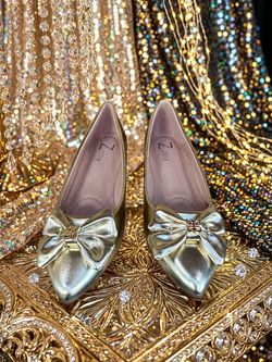 Gold ladies flats.