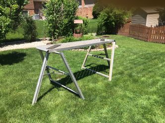 One Pair of metal tri-pods with extension poles. Scaffold Sold Separately 