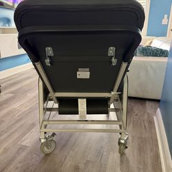 Leather wheel chair with foot rest