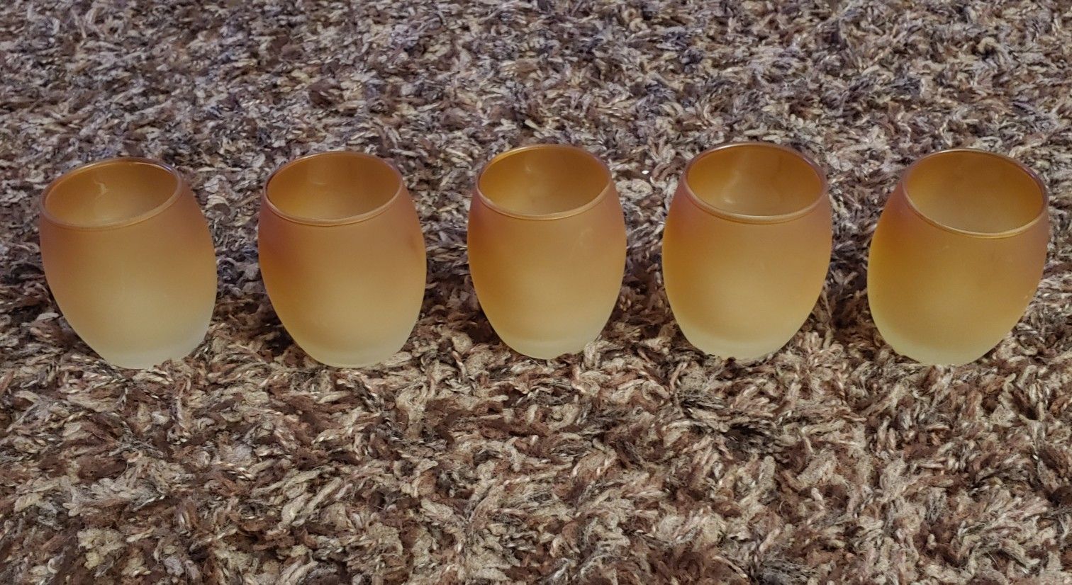 Amber/gold colored set of votive holders