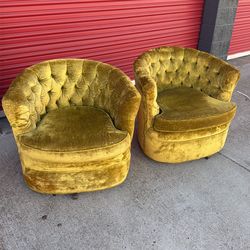 Pair of mid century style green swivel chairs