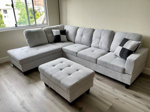 New Light Grey Sectional And Ottoman 