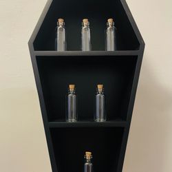 Coffin spice rack apothecary shelf.  