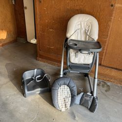 High Chair For Baby And Toddler With Extra Booster Seat And Lots Of Baby Toys And Books 