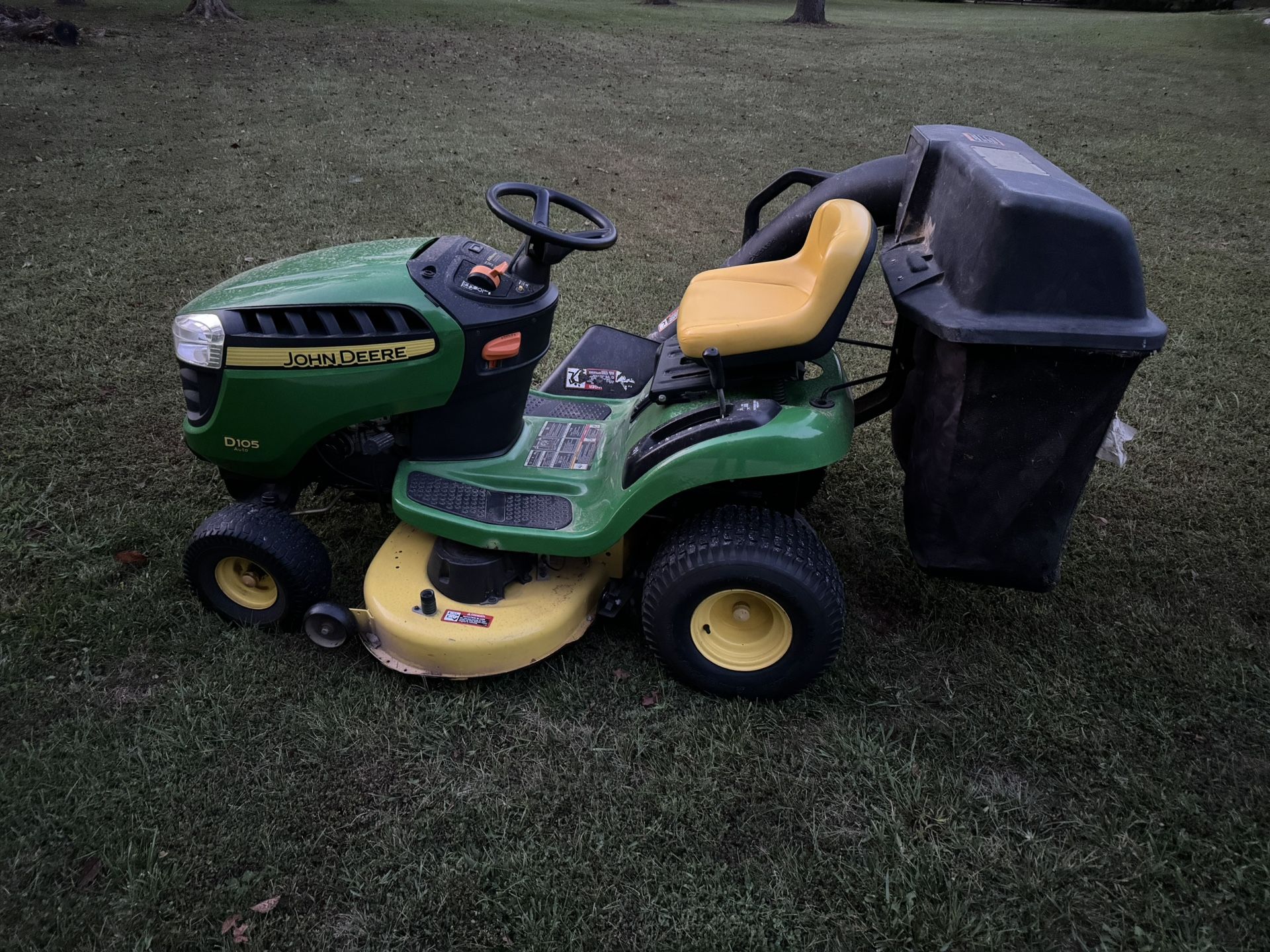 John Deere riding lawnmower with bagger attachment