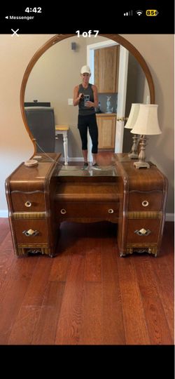Vintage art deco waterfall bedroom set. Includes vanity, dresser, and nightstand.