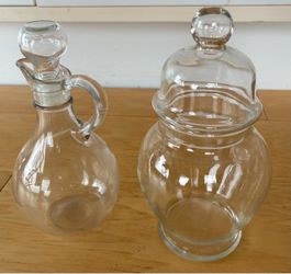 2 glass containers/dispensers, 7” tall. Buy both for $6.00