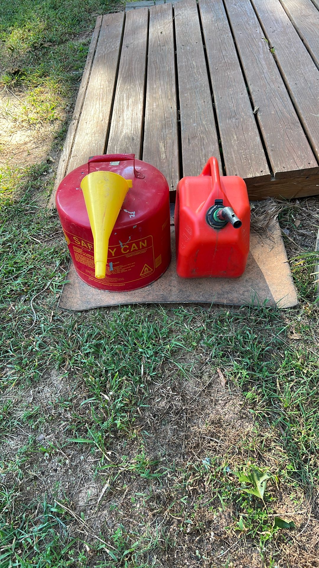 Two Gas Cans, One Metal One Plastic