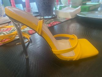 Yellow high heels