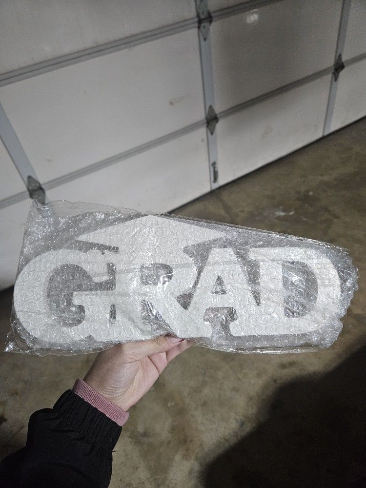 White Wooden GRAD Sign