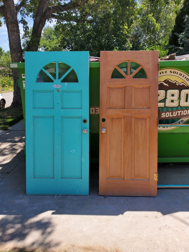 2 solid wood entry doors