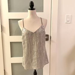 This is a striped sequined camisole-style tank top from the Banana Republic brand.