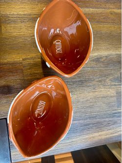 A set of Rae Dunn football bowls
