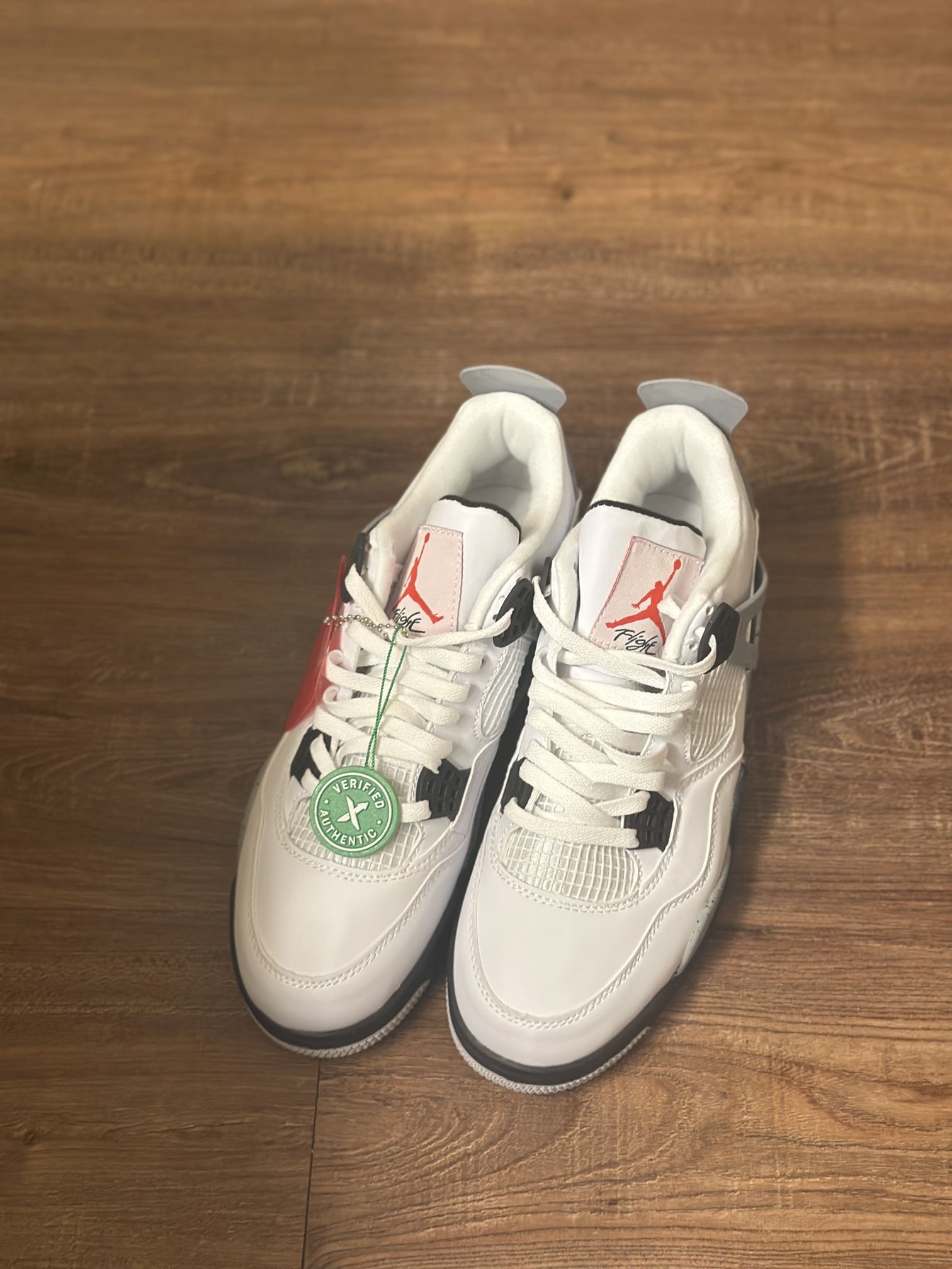 This is a Nike Air Jordan 4 Retro "White Cement
