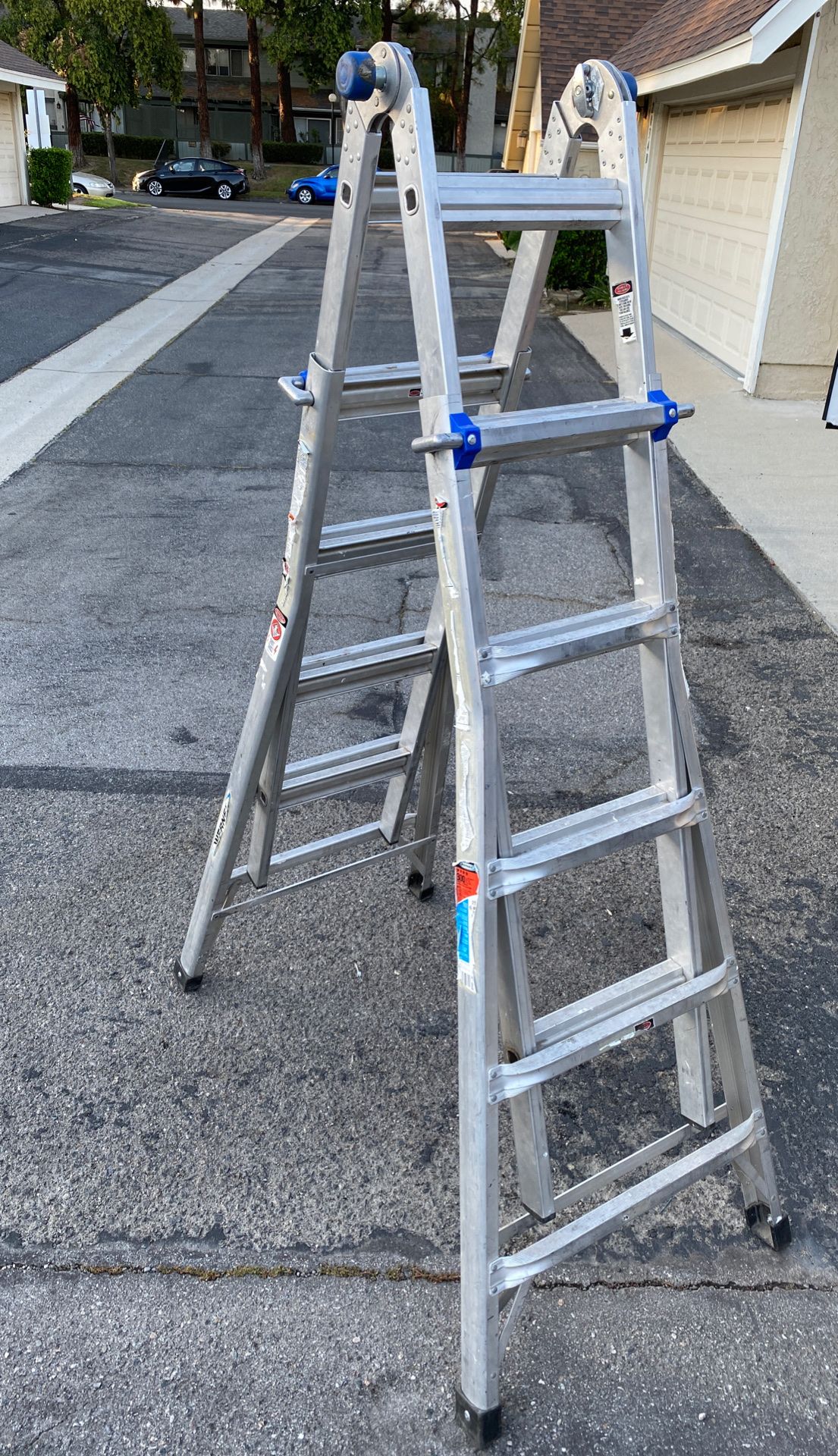 WERNER 22 ft. Reach Aluminum Telescoping Multi-Position Ladder with 300 lbs. Load Capacity Type IA Duty Rating