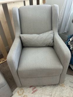 Nursery glider with storage ottoman