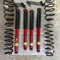 OEM Mopar Shocks and springs.