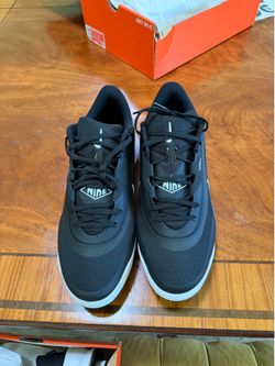 Black Nike baseball cleats size 14