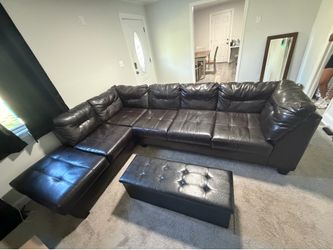 Black leather 2 piece sectional sofa with ottoman