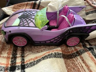 Mattel Monster High Ghoul Mobile convertible car in purple.