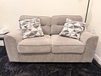 Light gray loveseat couch