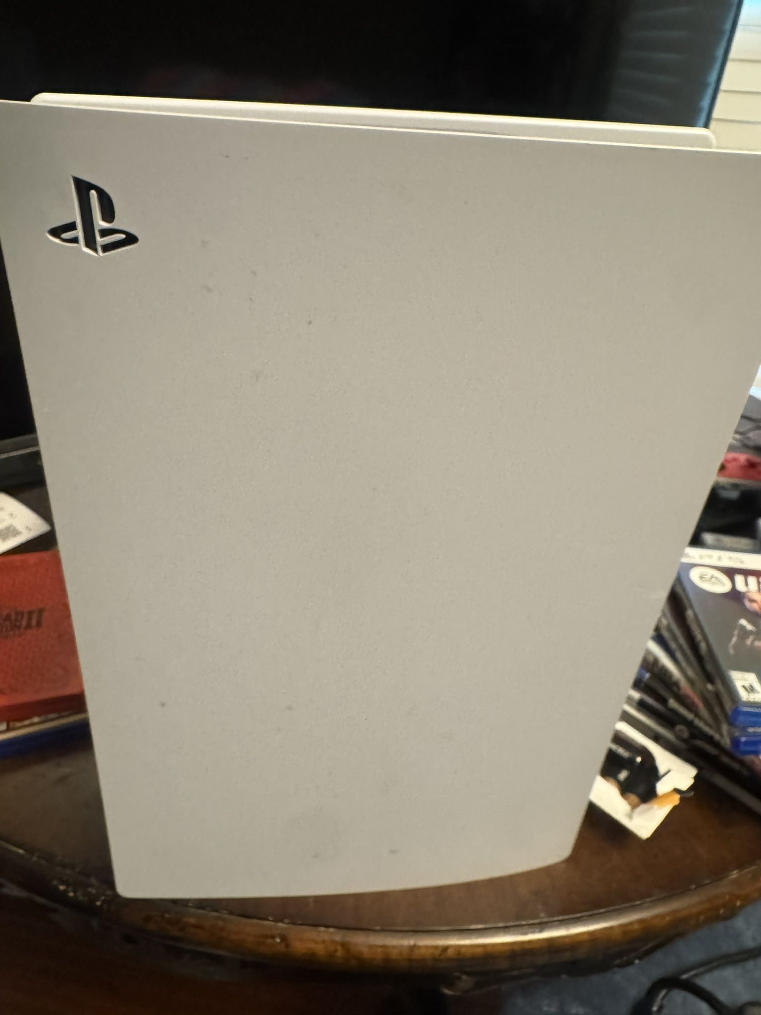 PS5 With Games, Two Controllers, Charging Station, And Cords.