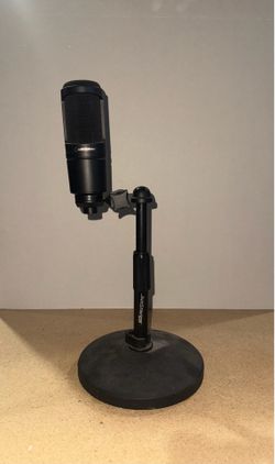 Audio-Technica AT2020 cardioid condenser microphone mounted on a JamStands broadcast arm