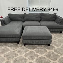 FREE DELIVERY - Grey Living Spaces Sectional With Ottoman