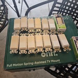 14 Legrand light switches and 1 Leviton 15A outlet