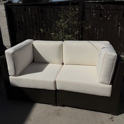 Brown Patio Wicker lounge chairs w/off white cushions