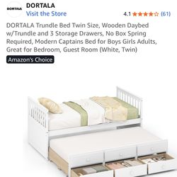 White Trundle Bed In The Shipping Box