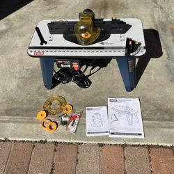 Ryobi A25RT01 Beginner router table and RYOBI 8.5 Amp 1-1/2 Peak HP Fixed Base Corded Router (Model R163). 
