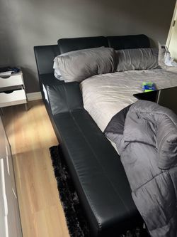Futuristic platform black faux leather queen bed