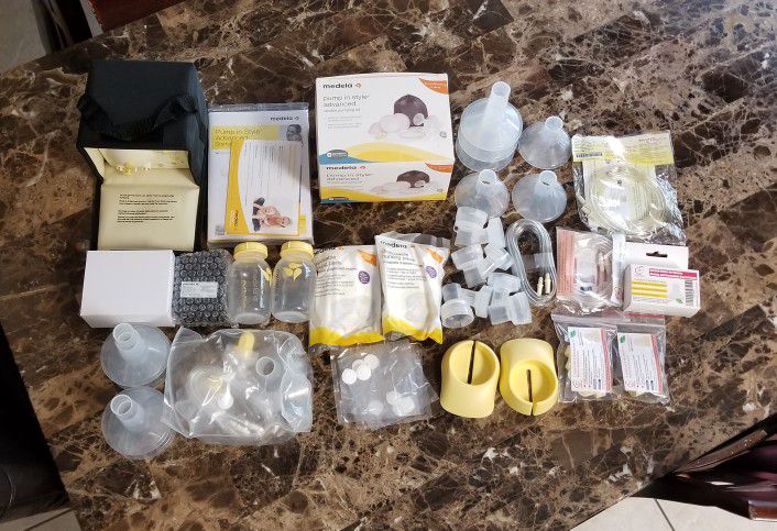 Electric Breast Pump w/ LOTS of Extra Accessories, Manual Breast Pump w/ Accessories, & Pumping Bra (2 pictures posted)