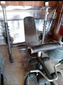 Almost new XRS-20 bench press and squat rack and olympic bar and 90lbs