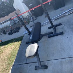 Weight Bench And 7 Ft Olympic Bar. 