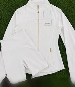 White and gold Lululemon jacket and shorts size 4/medium with tags