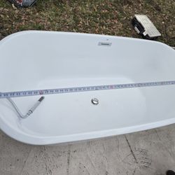 Bathtub with its tap. 