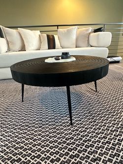 Round Dark Wood Coffee Table with Concentric Ring Top