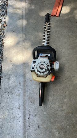 This is an Echo HC-1500 gas-powered hedge trimmer.