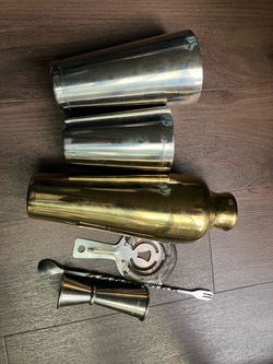 Stainless steel and gold cocktail shaker set