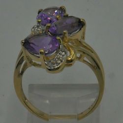 10kt yellow gold ring size 6 with 3 oval amethysts ; 6 diamonds 0.05 carat ; 3.8 gr total weight . 849101-1.  
