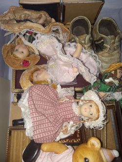 A Small Box Of Mini Porcelain Dolls And Frames Etc