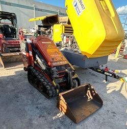Ditch Witch Stand Behind Skid Steer Loader