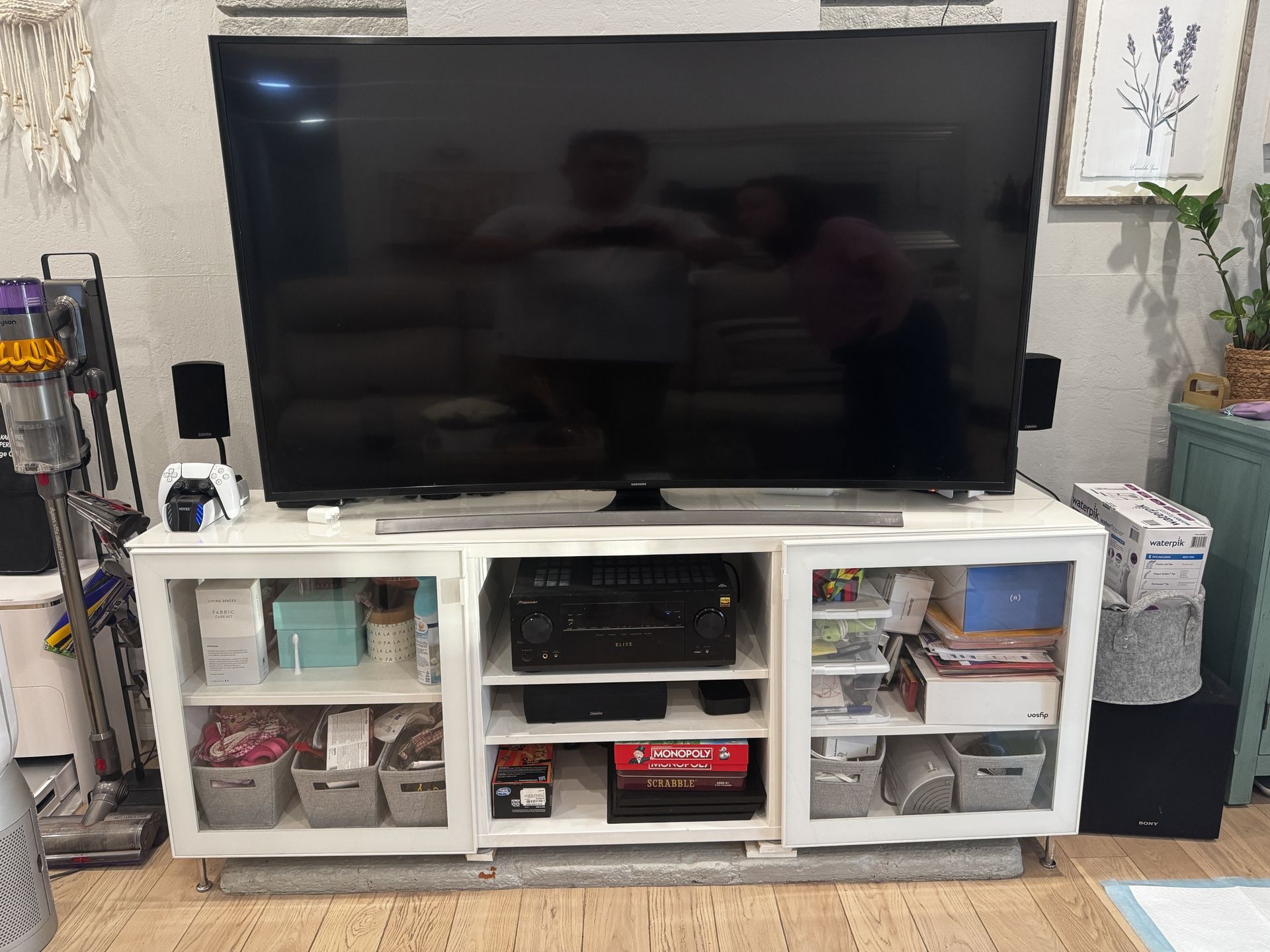 TV, receiver, subwoofer, and tv console